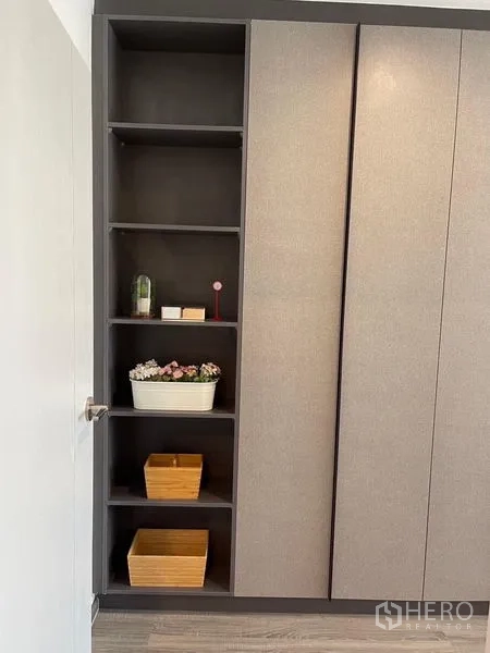 Condominium for rent - Tall wardrobe with open shelves for organized storage and décor.