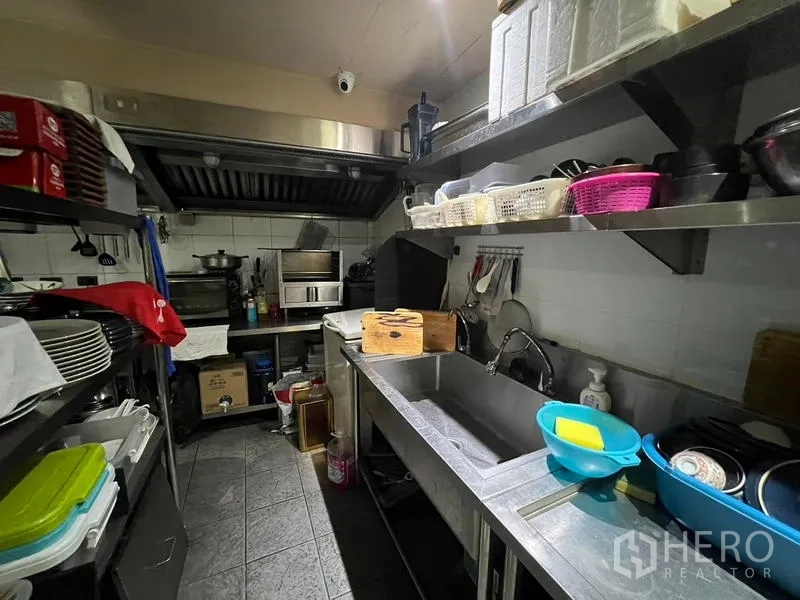 Retail Space for rent in Bang Rak, Bangkok - Commercial kitchen with stainless steel counters, sink, and exhaust hood.