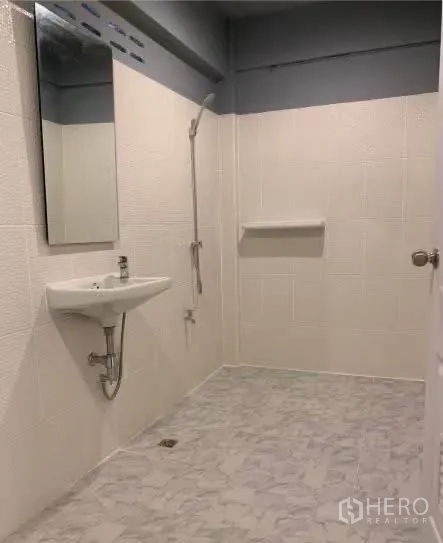 Home Office for rent in Sathon, Bangkok - Wet-room style bathroom with shower, sink, and mirror.