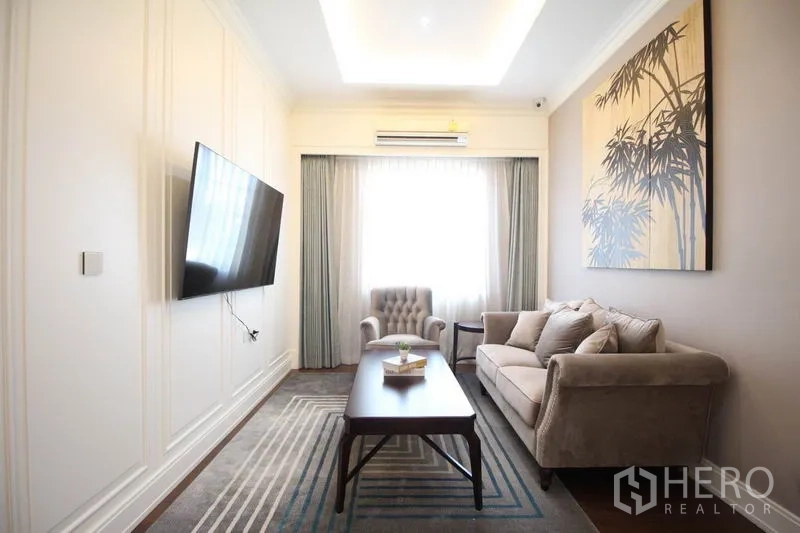 Detached House for rent or sale - Cozy family room with sofa set, wall-mounted TV, window drapes and feature artwork.