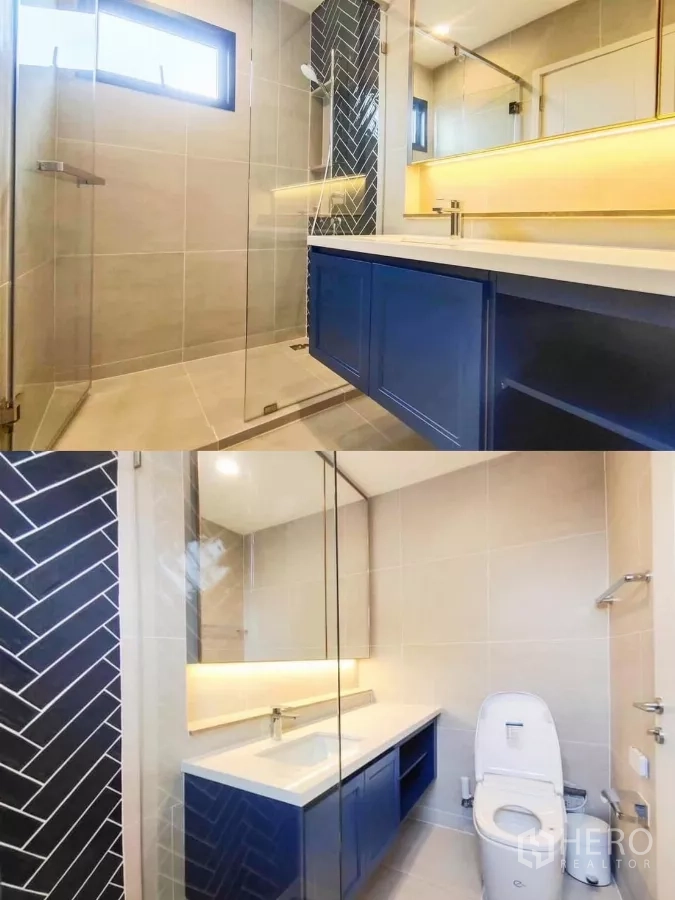 Detached House for rent in Khan Na Yao, Bangkok - Modern bathroom with glass shower, blue vanity cabinets and backlit mirror.