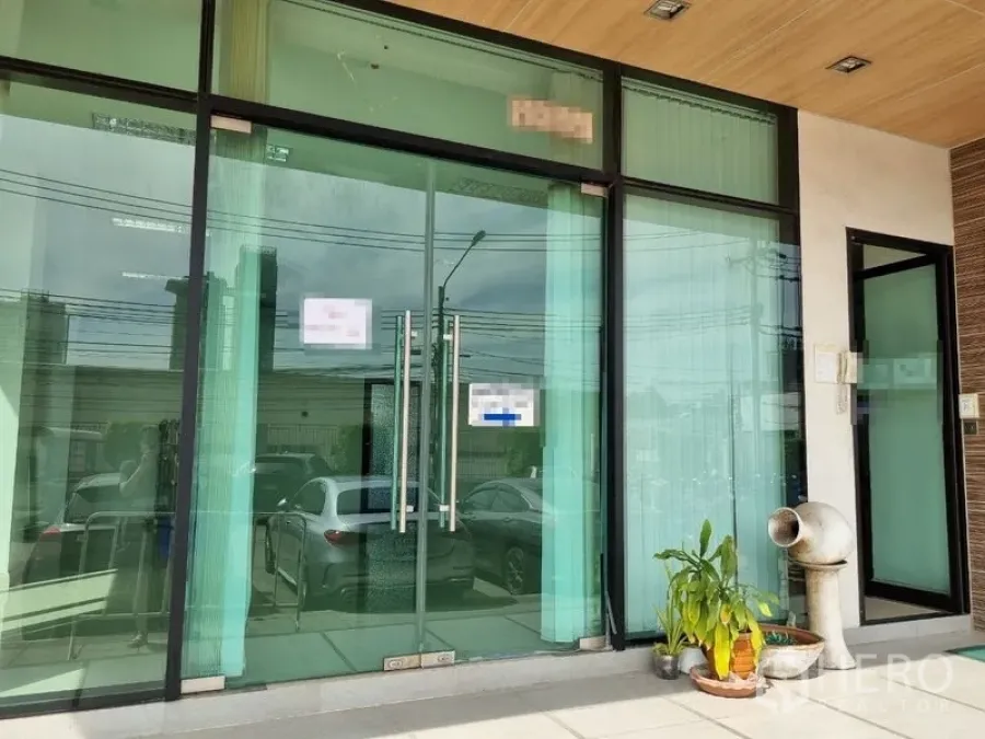 Office Space for rent in Bang Kho Laem, Bangkok - Street-facing glass storefront of the office with double doors under a wood ceiling canopy and potted plants.