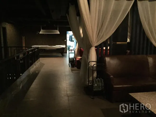 Retail Space for rent in Watthana, Bangkok - Upper-level corridor with curtain dividers, leather sofa and covered pool table.