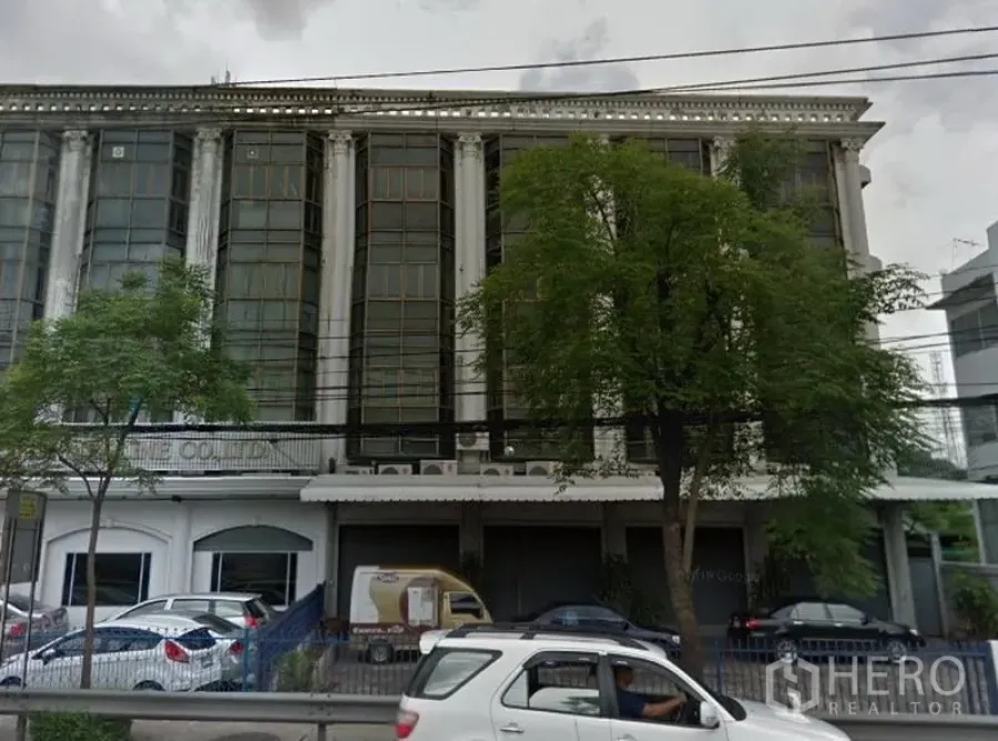 Office Space for rent in Huai Khwang, Bangkok - Front façade of a multi‑storey office building with parking area.