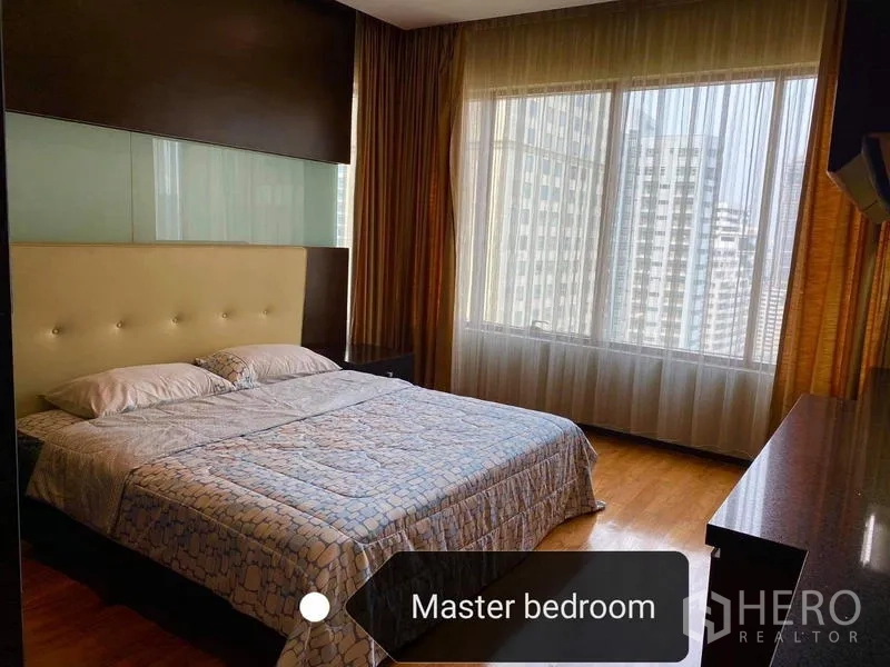Condominium for rent - Master bedroom with upholstered headboard, wood floors and floor-to-ceiling window