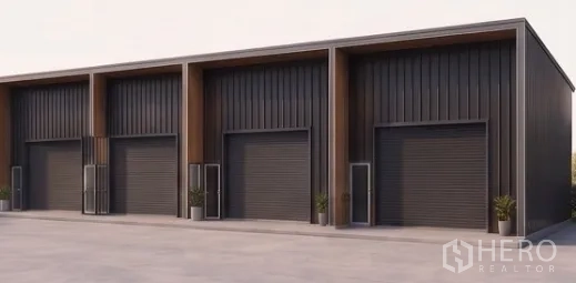 Warehouse for rent in Prawet, Bangkok - Row of modern warehouse units with large roller shutters and separate entry doors.