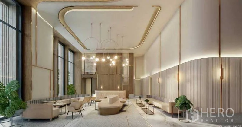 Condominium for sale in Sathon, Bangkok - Elegant high-ceiling condominium lobby with designer lighting and lounge seating.