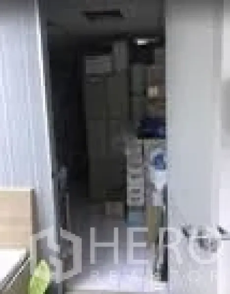 Office Space for rent in Khlong Toei, Bangkok - Compact utility or storage room with cabinets and stacked supplies in a narrow space.