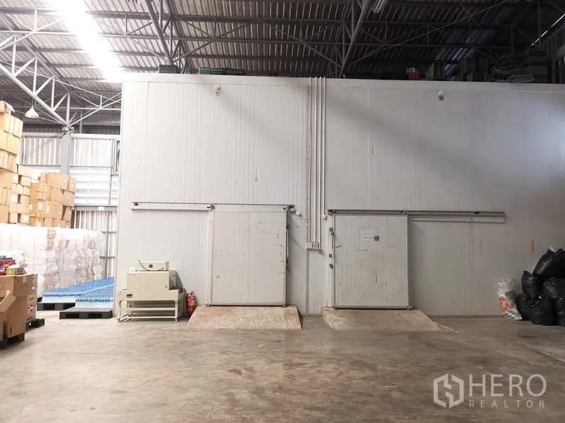 Warehouse for rent or sale in Nonthaburi - Cold storage rooms inside the warehouse with insulated sliding doors.