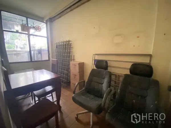 Retail Space for rent in Watthana, Bangkok - Compact room with window, table and chairs, suitable for an office or meeting space.