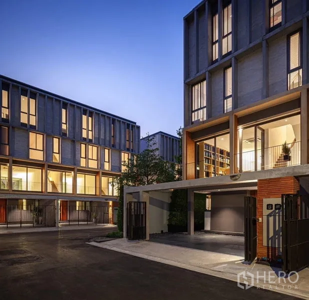Townhouse for rent - Contemporary 3.5-storey townhouse facades with carports at dusk