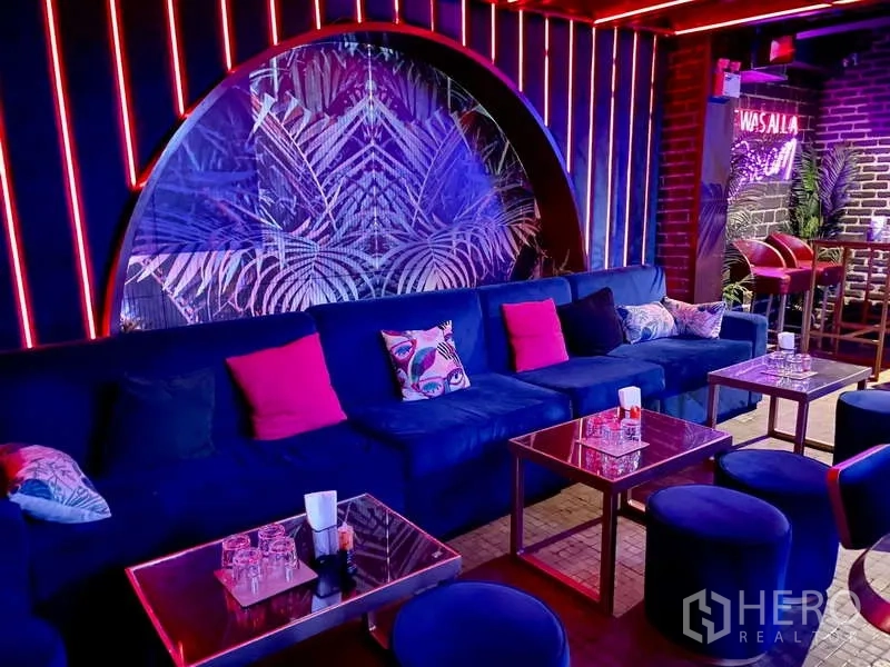 Retail Space for rent in Bangkok - Colorful lounge with blue sofa, accent pillows and mirrored arch feature.