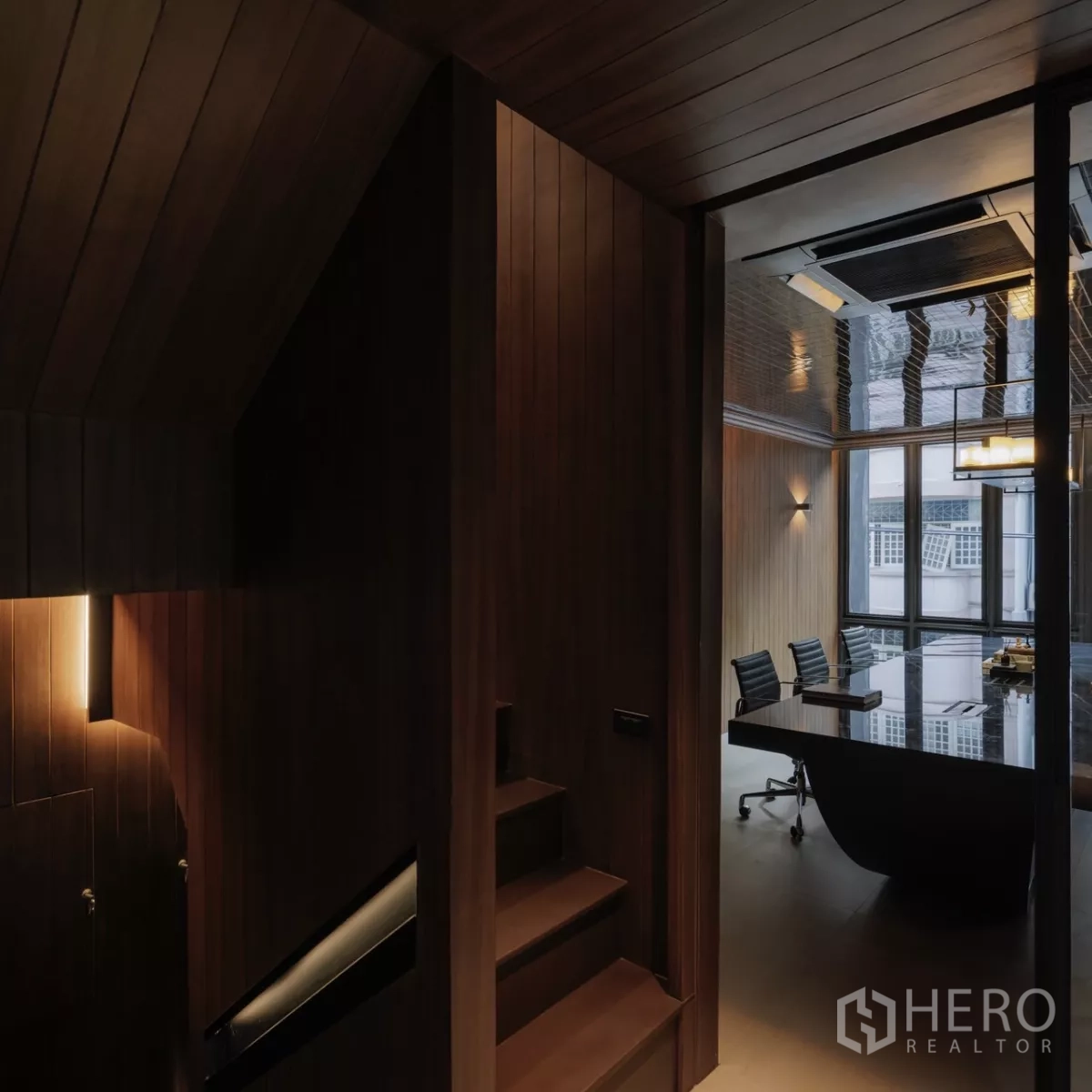 Office Space for rent in Bang Rak, Bangkok - Stair landing beside a boardroom with glass partition and rolling chairs