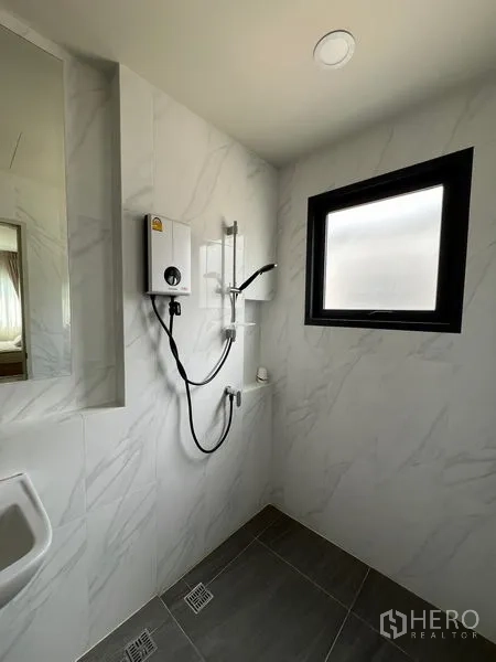 Detached House for rent in Bang Phli, Samut Prakan - Shower area with water heater, handheld spray and window.
