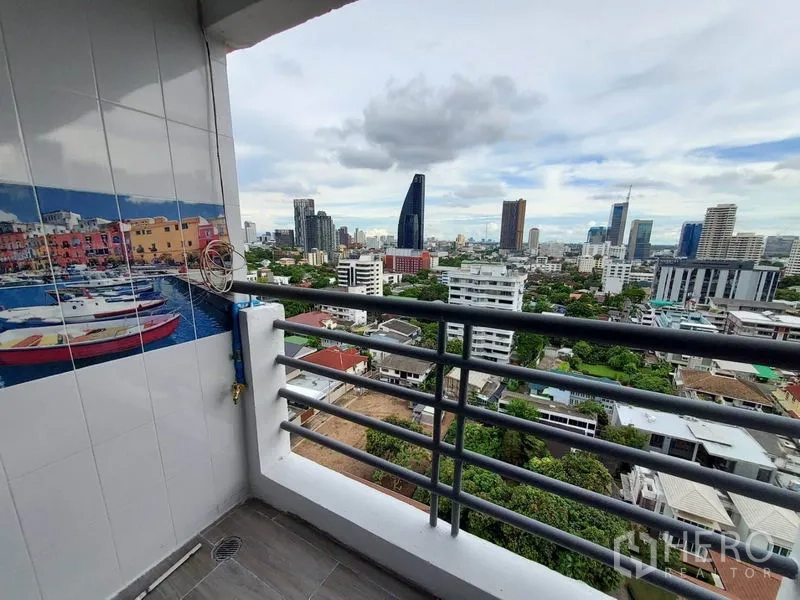 Condominium for rent or sale in Khlong Toei, Bangkok - Balcony corner with railings and expansive city views toward the EM District.