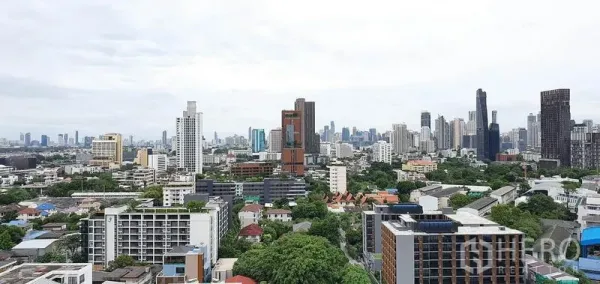 Condominium for sale in Khlong Toei, Bangkok - Panoramic Bangkok skyline view from a high-floor Sukhumvit condominium.