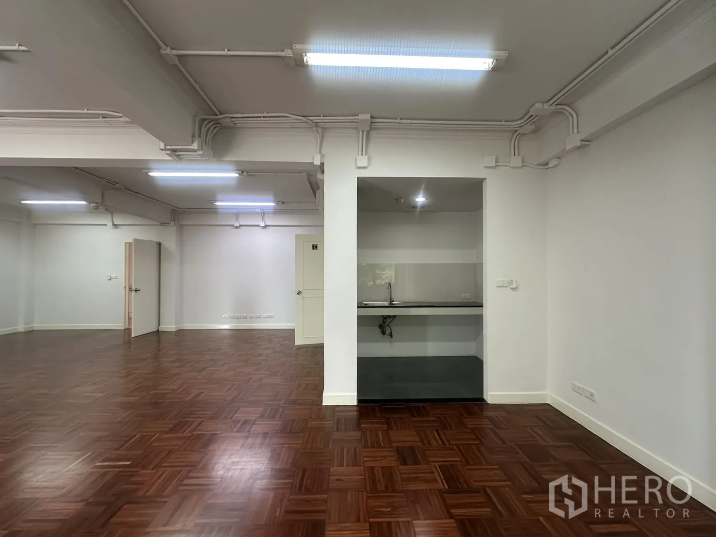 Office Space for rent in Watthana, Bangkok - Compact pantry nook with sink and countertop inside the office.
