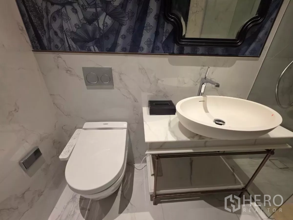 Condominium for rent - Walk-in closet with dark wood cabinetry and open shelving.