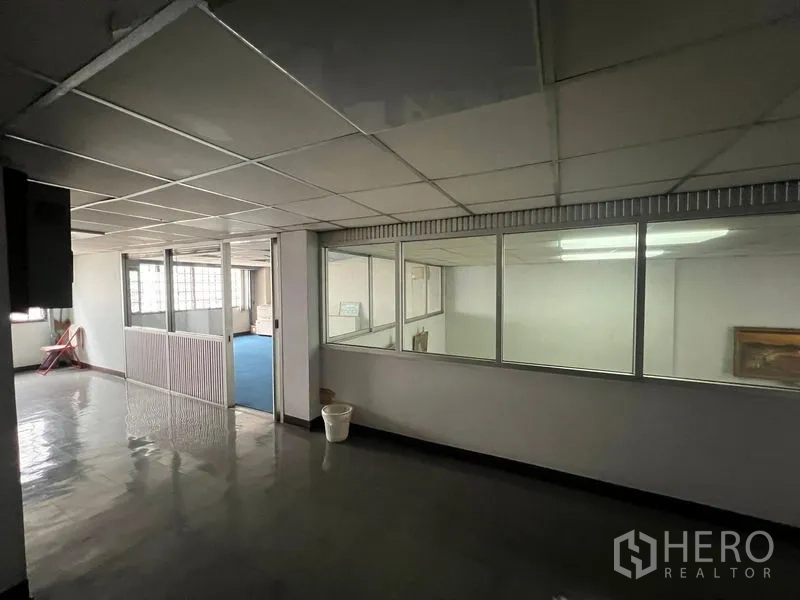 Shophouse for sale - Upper-floor corridor with internal windows and partitioned rooms.
