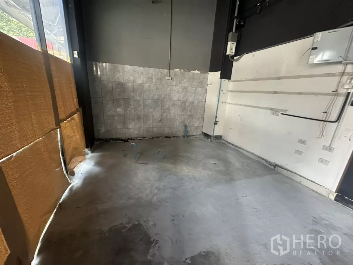 Retail Space for rent - Rear wall area with tiled splashback, multiple power outlets and plumbing points ready for fit-out.