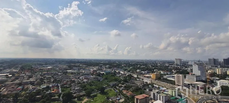 คอนโด ให้เช่าในBang Kapi, Bangkok - วิวเมืองบางกะปิแบบพาโนรามาในช่วงกลางวันใต้ท้องฟ้ามีเมฆบางส่วน