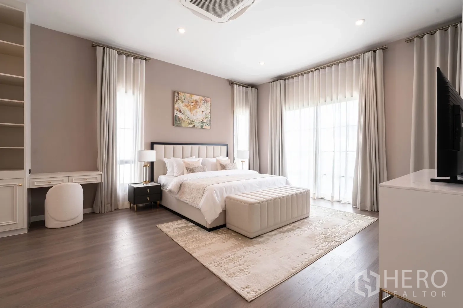 Detached House for rent in Bang Phli, Samut Prakan - Corner master suite featuring desk, shelving, and wide windows for natural light.
