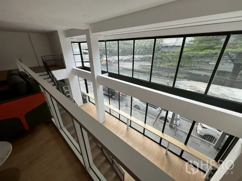 Retail Space for rent in Watthana, Bangkok - View from the mezzanine over the double-height facade windows and street below.