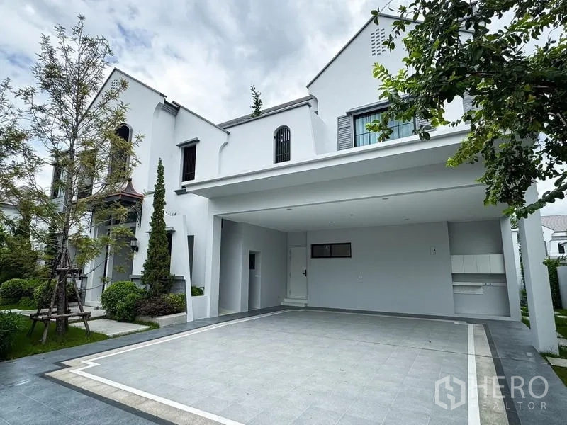 Detached House for rent or sale - Covered carport and paved driveway beside a landscaped garden.