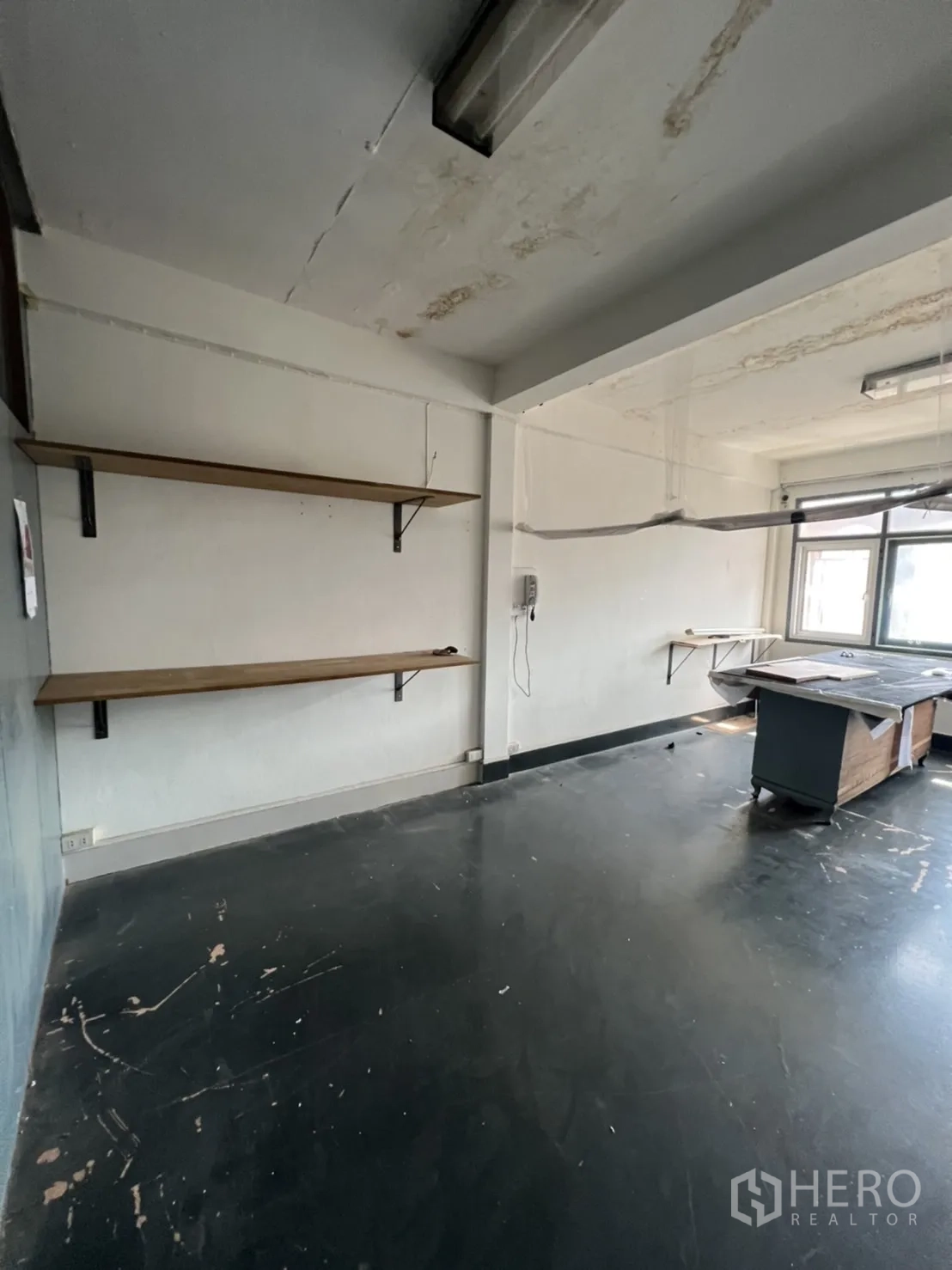 Shophouse for rent or sale in Watthana, Bangkok - Secondary restroom with gray tiled wall and exposed plumbing.