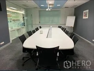 Office Space for rent in Bang Rak, Bangkok - Boardroom with long conference table for 10–12, projector and glass wall in a modern Bangkok office.