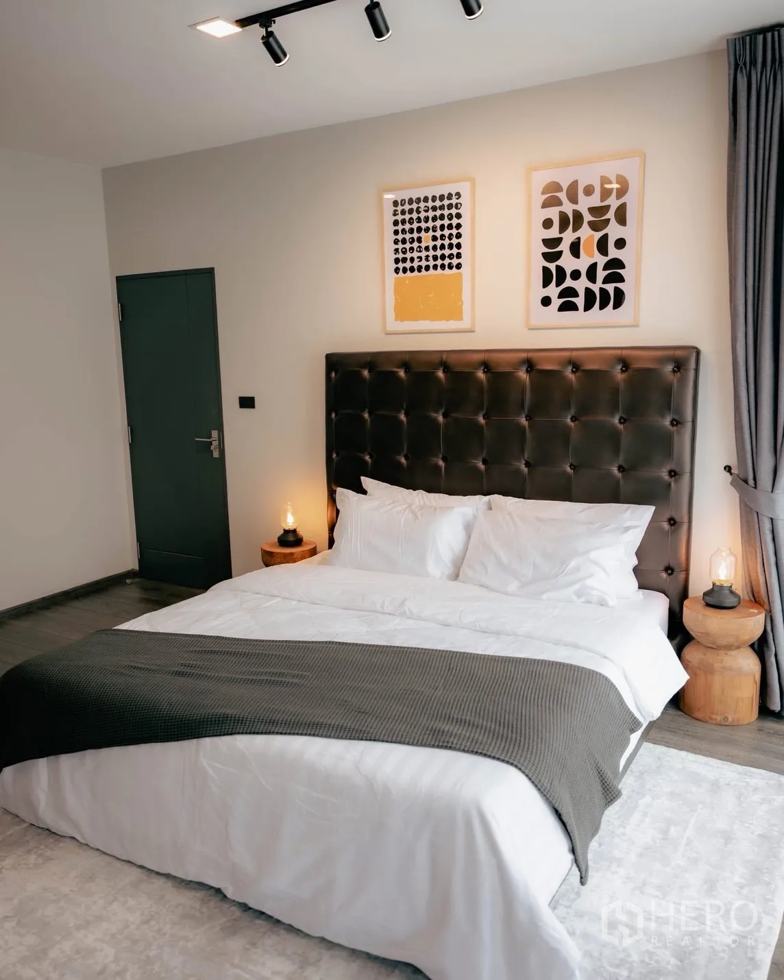Detached House for rent or sale in Bang Phli, Samut Prakan - Master bedroom with tufted headboard, bedside tables and crisp white bedding.