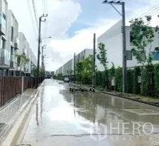 Home Office for rent in Don Mueang, Bangkok - Tree-lined internal street in a gated modern townhouse community.