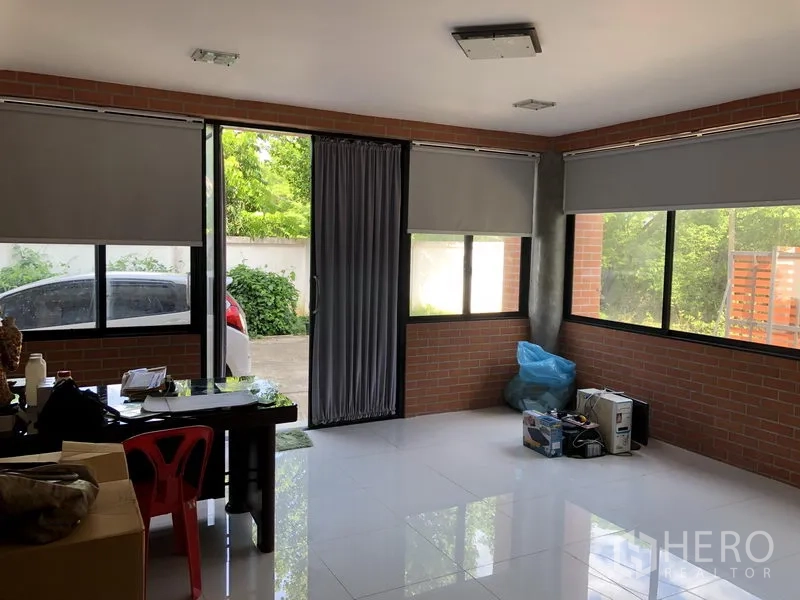 Factory for rent or sale in Lat Lum Kaeo, Pathum Thani - Clean bathroom with glass-enclosed shower and white ceramic tiles.