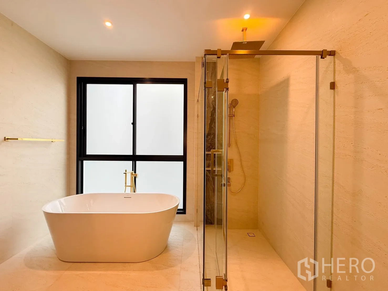 Detached House for rent or sale in Bang Kapi, Bangkok - Close-up of freestanding bathtub by sliding windows and indoor plants.