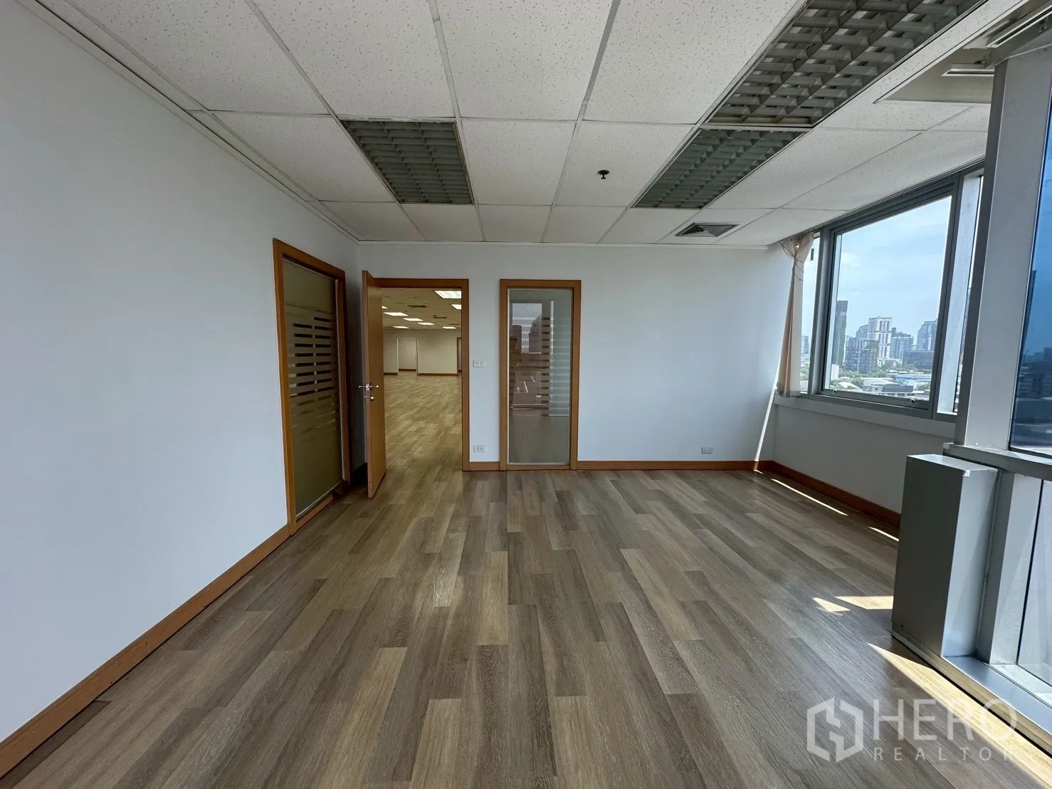 Office Space for rent - Bright executive office with large windows and skyline views over Ekkamai.