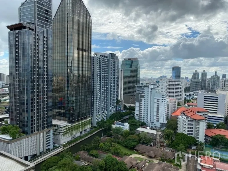 Condominium for rent or sale in Watthana, Bangkok - High‑rise city view showcasing Bangkok business district towers and surrounding buildings.