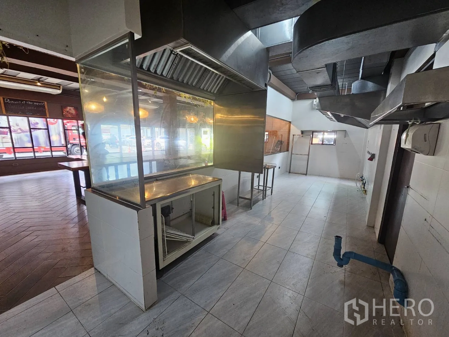 Retail Space for rent in Watthana, Bangkok - Commercial kitchen zone featuring extractor hoods, tiled walls and a pass-through window.