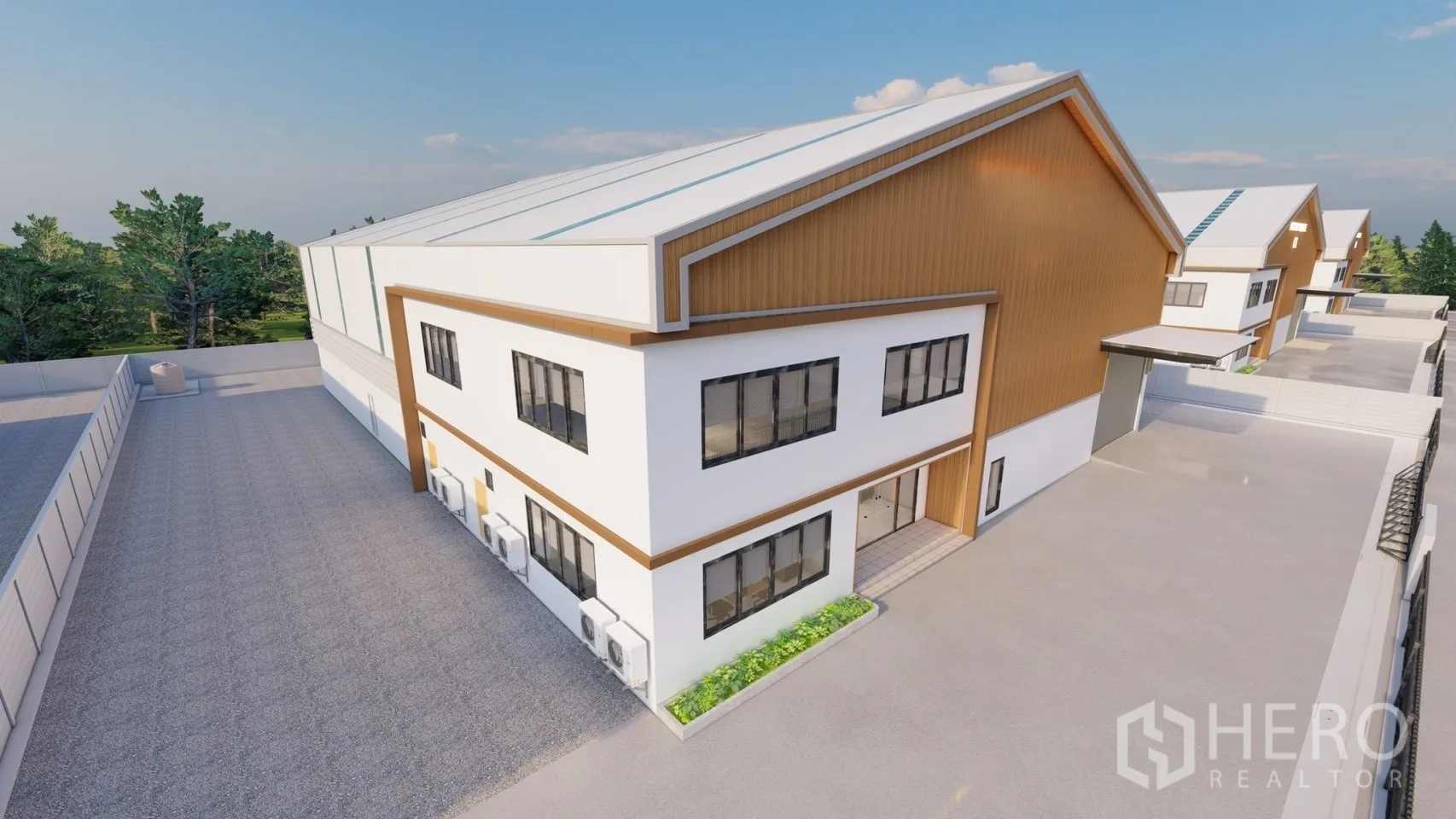 Factory for rent or sale in Lam Luk Ka, Pathum Thani - Angled view of side elevation with large windows, air-conditioning units, and landscaped strip.