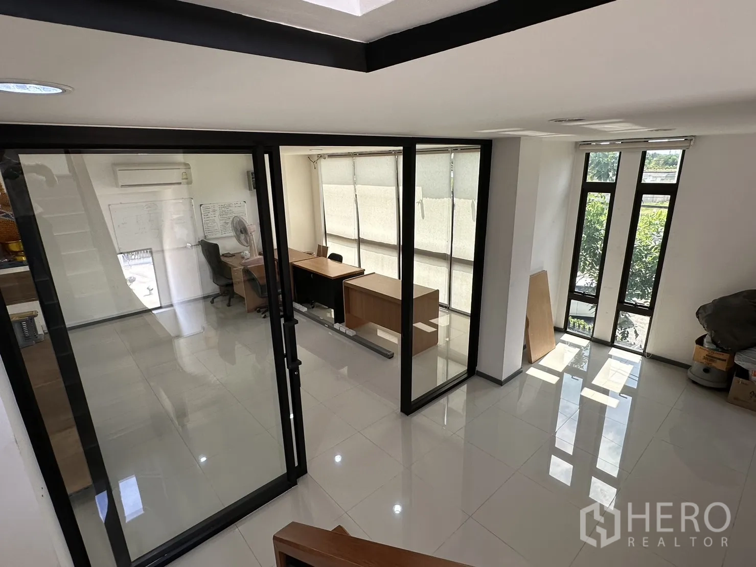 Factory for rent or sale in Pathum Thani - Upper floor glass-partitioned meeting rooms with natural light.