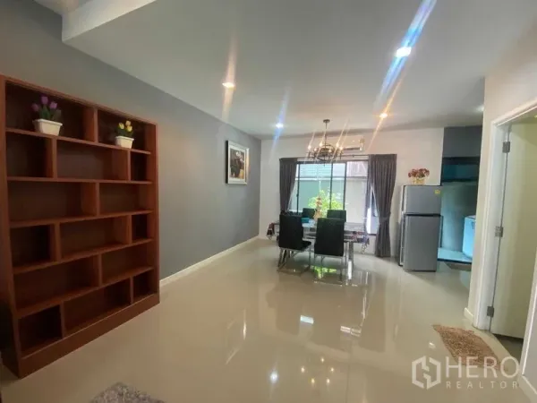 Home Office for rent or sale in Bang Phli, Samut Prakan - Dining zone with large window, curtains, and fridge beside the kitchen.
