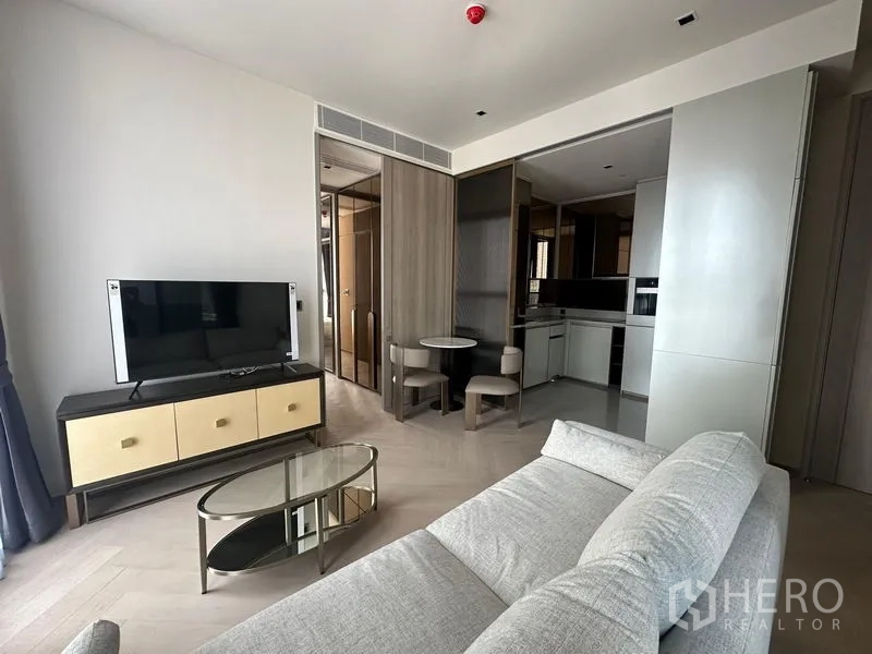 Condominium for rent - Open-plan living area facing a compact dining nook and fitted kitchen.