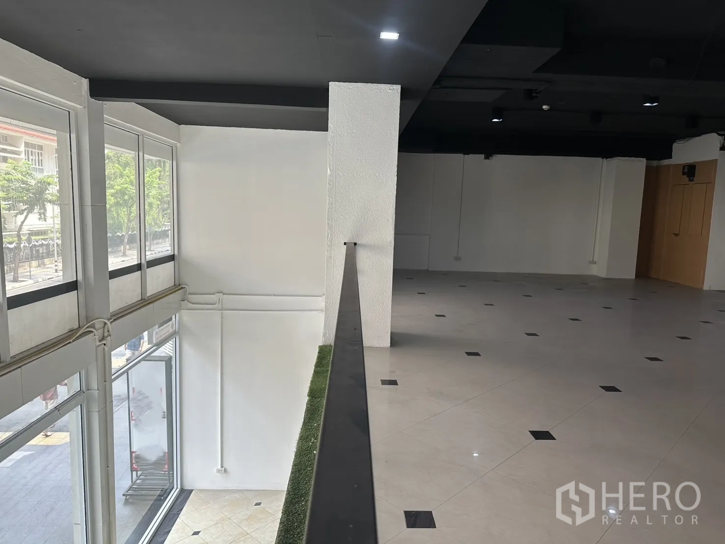 Retail Space for rent in Pathum Wan, Bangkok - View from the mezzanine over the double-height windowed facade.