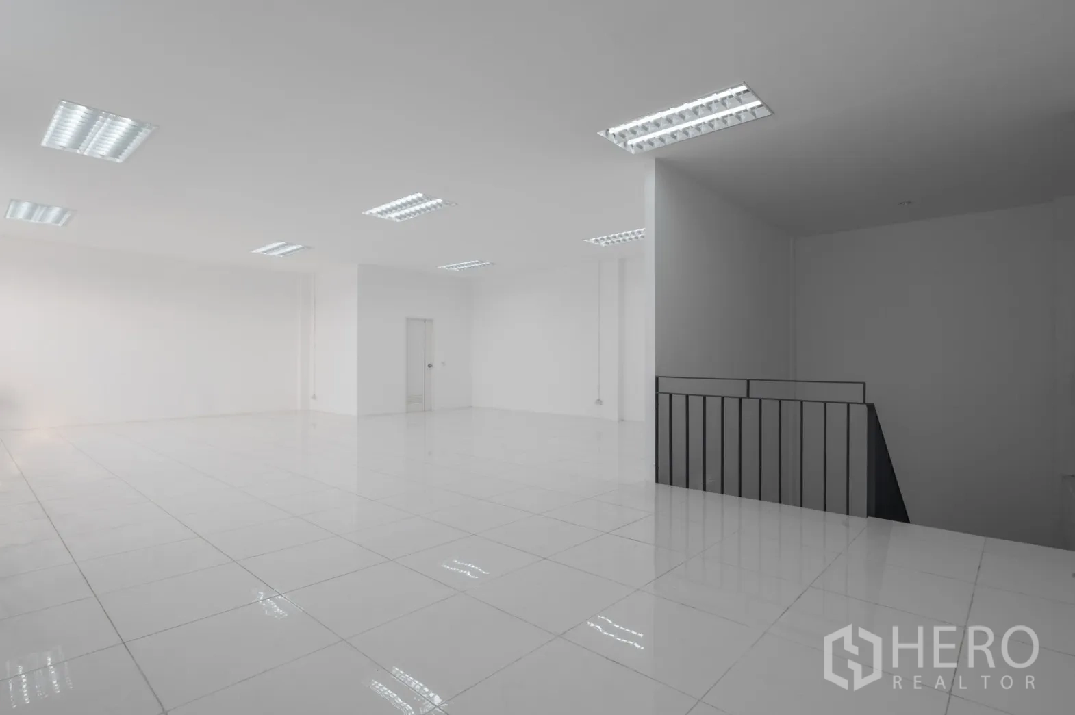 Factory for rent in Pathum Thani - Upper-floor office area with stairwell and bright lighting.