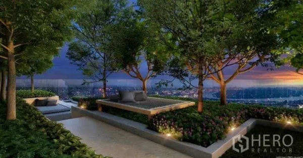 Condominium for sale in Sathon, Bangkok - Rooftop garden terrace with trees, seating nooks, and sunset views over the city.