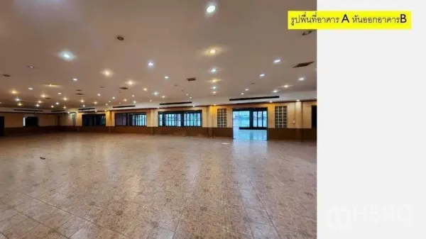 Retail Space for rent in Yan Nawa, Bangkok - Expansive column-free hall with tiled floors, recessed lighting, and windows along the wall.