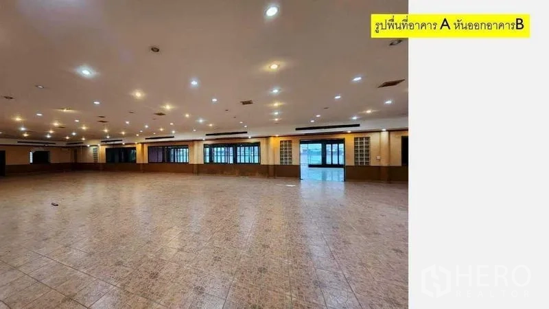 Retail Space for rent in Yan Nawa, Bangkok - Expansive column-free hall with tiled floors, recessed lighting, and windows along the wall.
