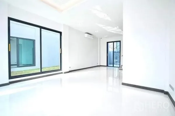 Home Office for rent in Don Mueang, Bangkok - Bright ground-floor open space with large sliding glass doors and garden strip view.