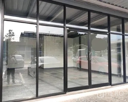 Retail Space for rent in Khlong Toei, Bangkok - Street-level glass storefront with double doors and a covered frontage.
