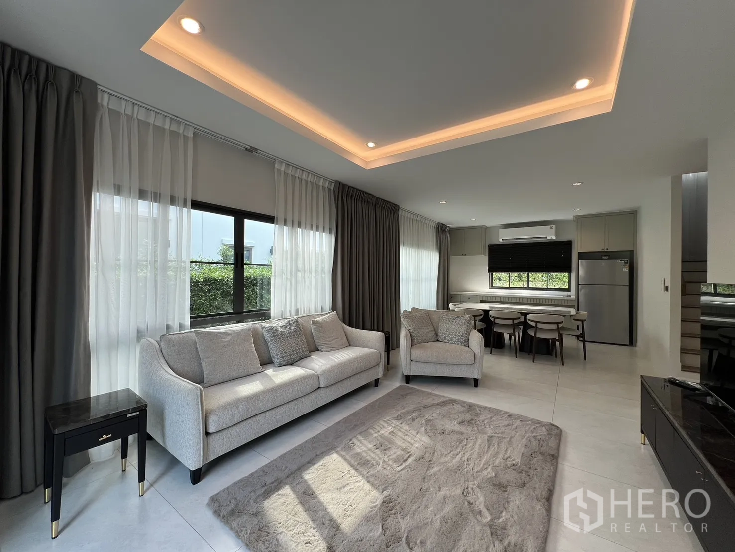 Detached House for rent in Bang Phli, Samut Prakan - Living area with recessed cove lighting beside the dining space.