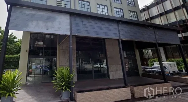 Retail Space for rent in Watthana, Bangkok - Building facade with multiple glass shopfront bays under an awning.